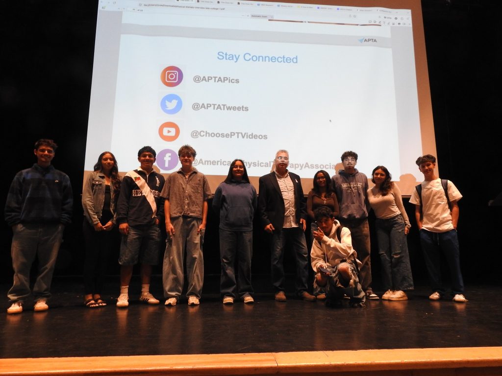 Paradigm CEO Donald Sanchez at Los Lunas High School 2 Donald Sanchez with Los Lunas High School HOSA and DECA students on stage after his presentation