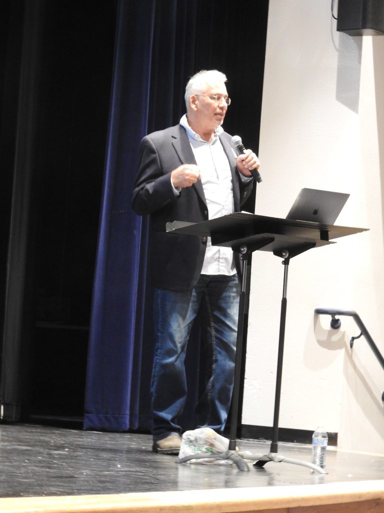 Paradigm CEO Donald Sanchez at Los Lunas High School 3 Paradigm CEO Donald Sanchez speaking at the podium at Los Lunas High School